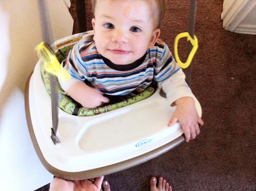 baby in used baby clothes