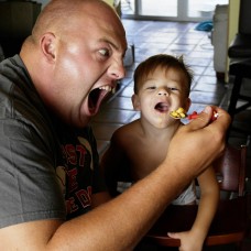 father and son sharing a meal